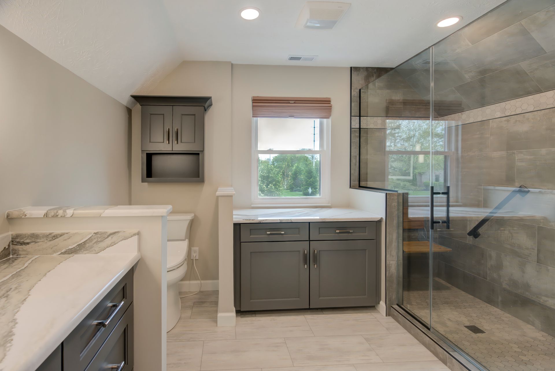 A bathroom with a walk in shower and a toilet.