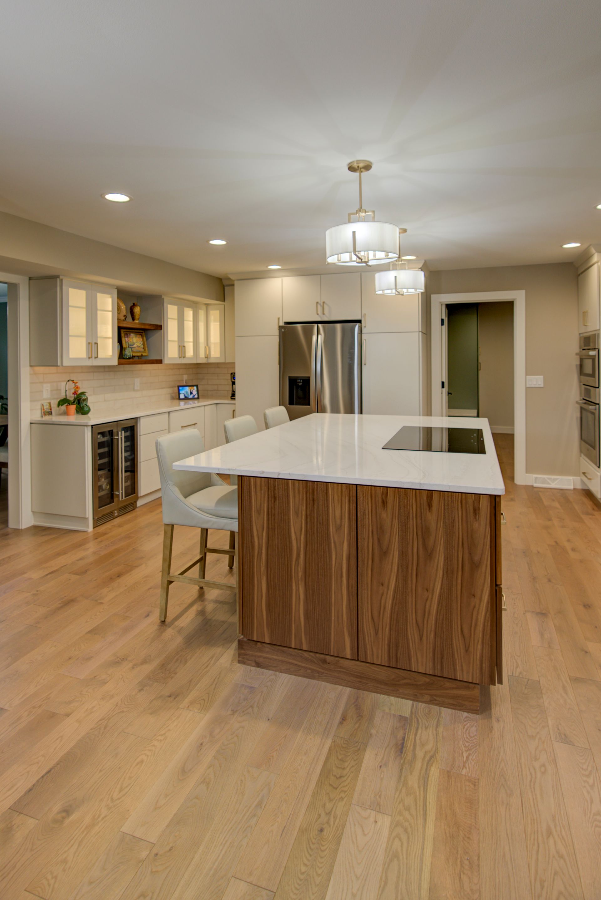 There is a large island in the middle of the kitchen.