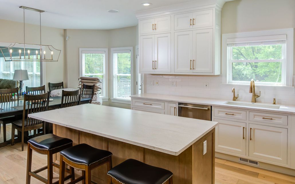 There is a large island in the middle of the kitchen.