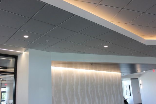 A room with a ceiling that has a light on it