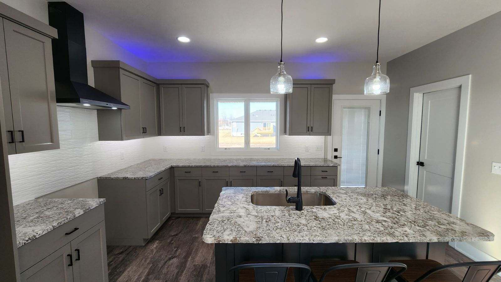 a kitchen with modern lighting design