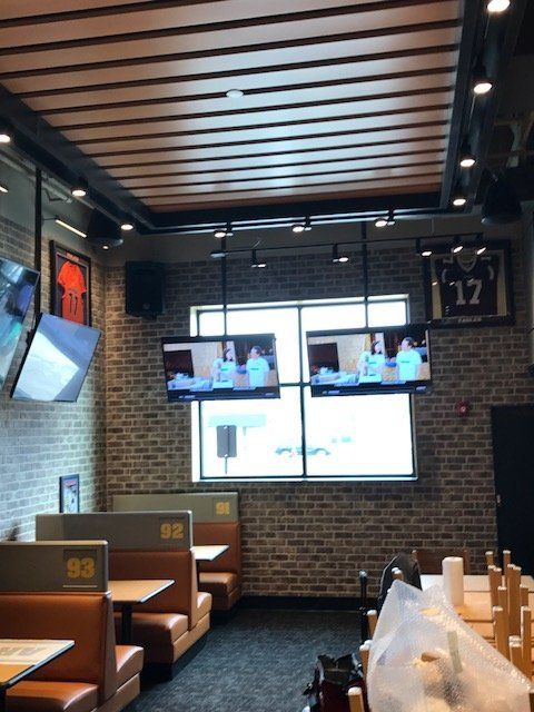 A restaurant with a number 17 jersey on the wall