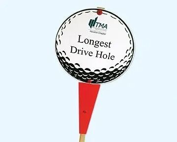 Golf course marker: white, golf ball-shaped sign with text 