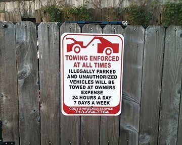 Sign on a wooden fence: 