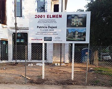 Construction site with sign for 2001 Elmen, featuring house renderings, contact info for Patricia Dejani.