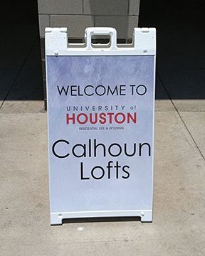 White sandwich board sign: 