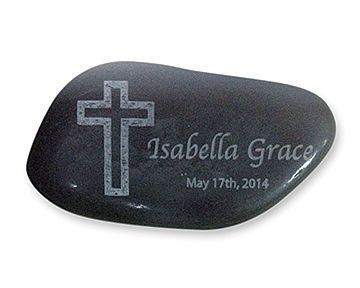 Black stone with engraved cross, Isabella Grace, and date May 17th, 2014.
