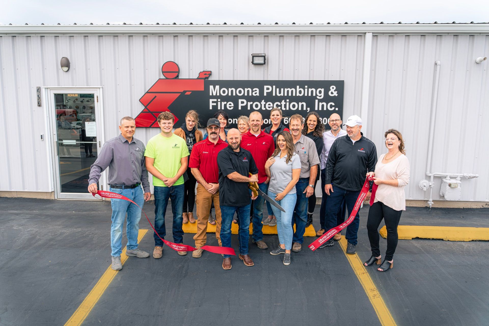 A group of people are standing in front of a building.
