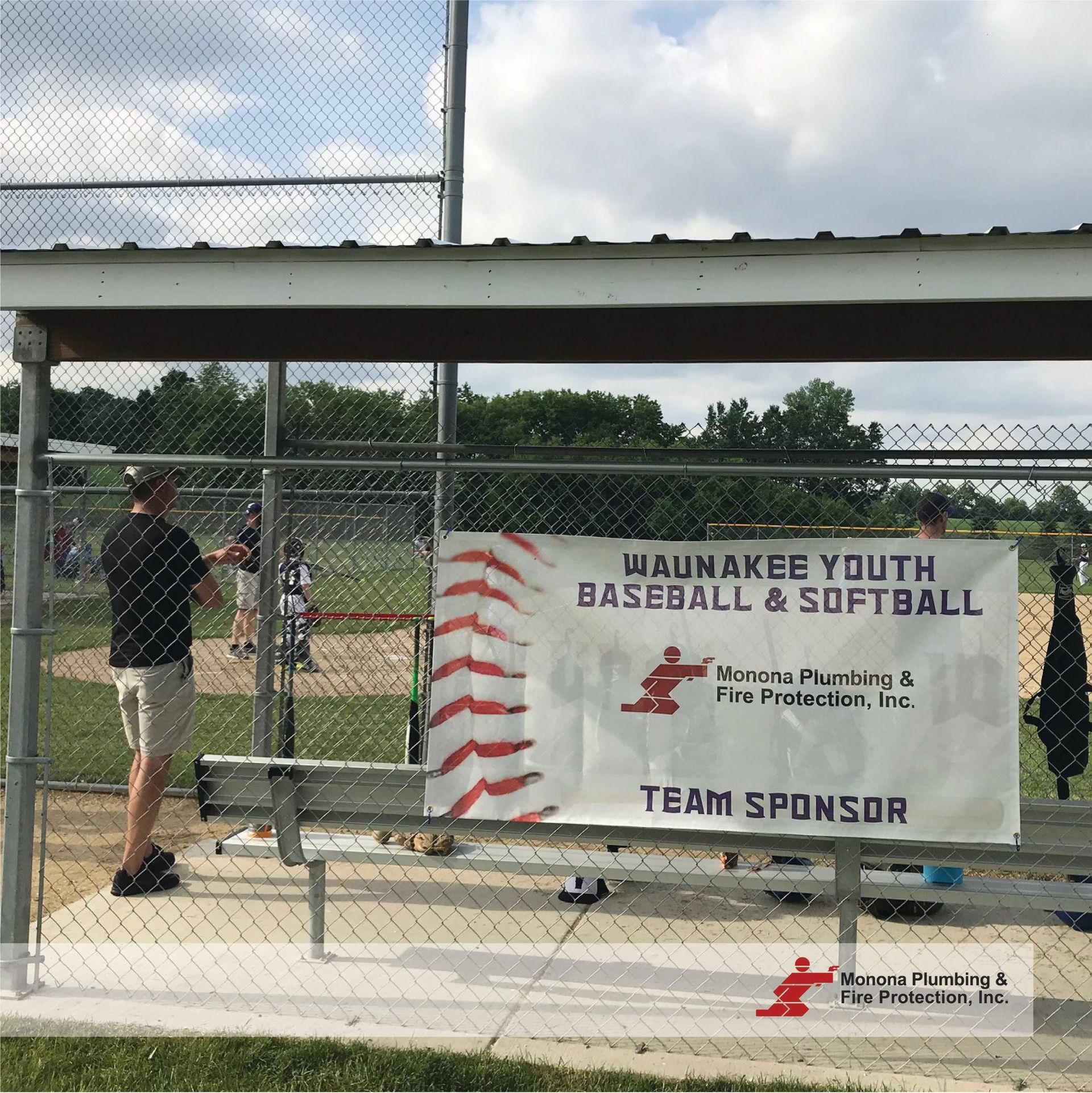 A sign for wauwakee youth baseball and softball