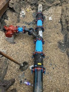 Underground water pipe system being repaired