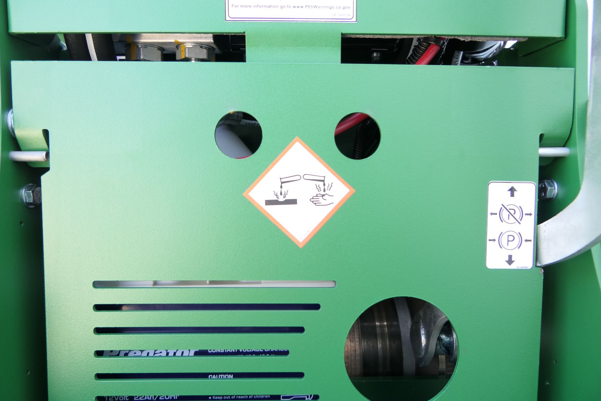 A green box with a warning sign on it