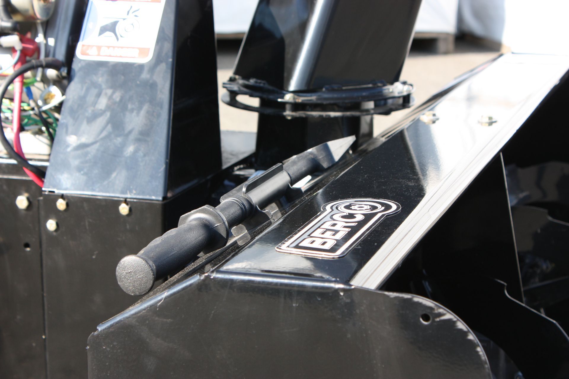 A close up of a snow blower 54
