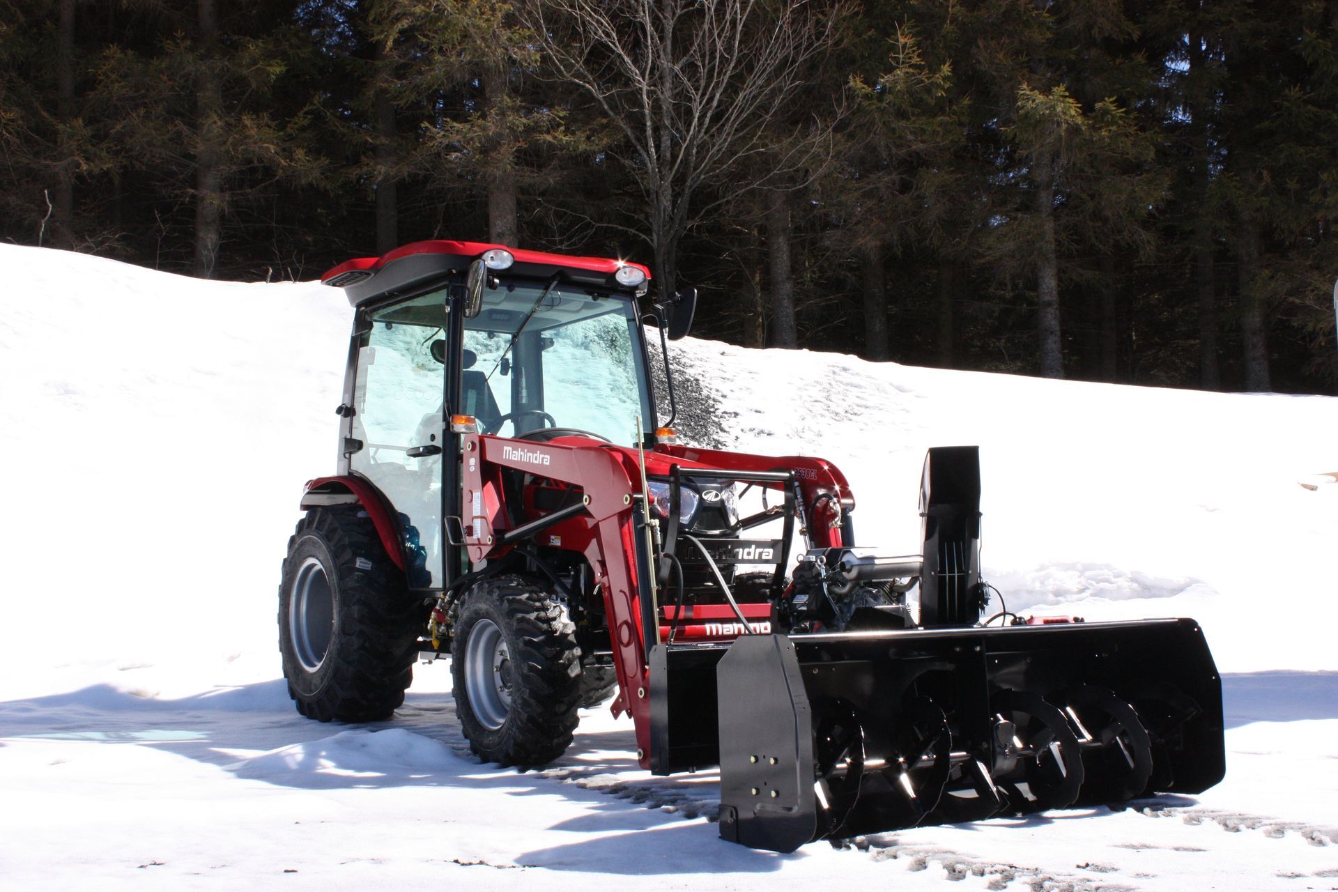 A red tractor with a snow blower 66″ VANTAGE SNOWBLOWER FOR TRACTORS EQUIPPED WITH