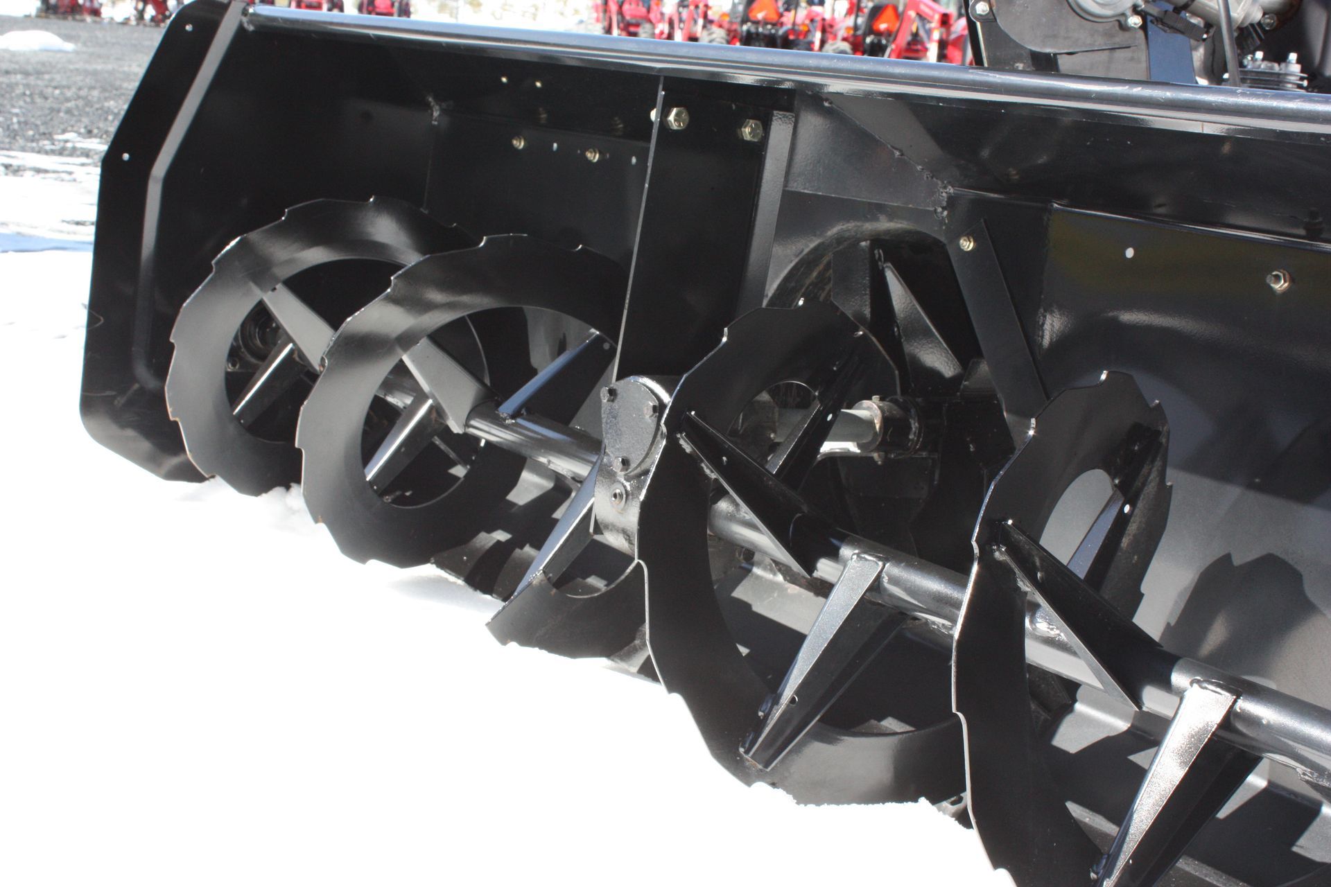 A black snow blower 72″ VANTAGE SNOWBLOWER FOR TRACTORS EQUIPPED WITH