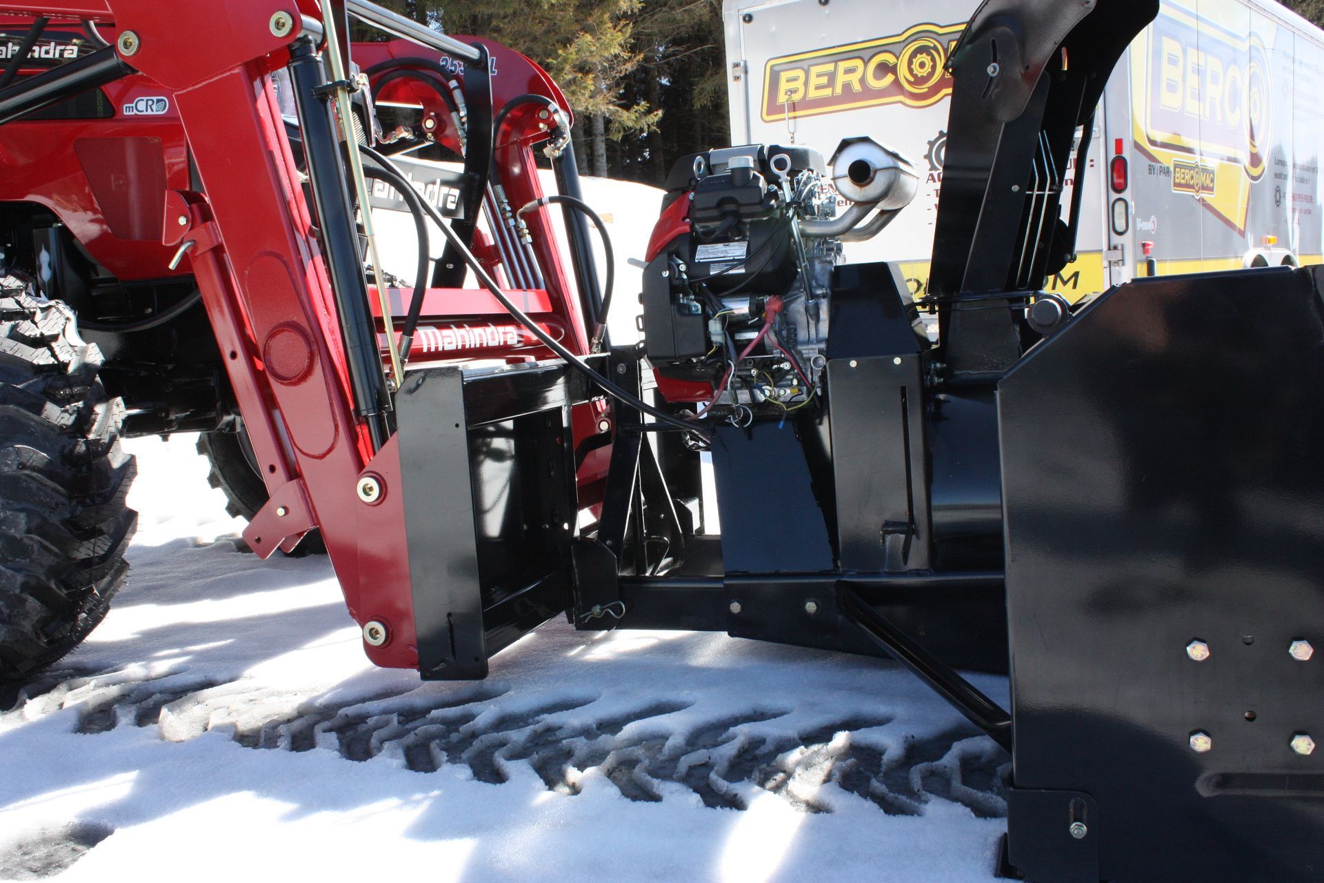 A red tractor with a snow plow 72″ VANTAGE SNOWBLOWER FOR TRACTORS EQUIPPED WITH