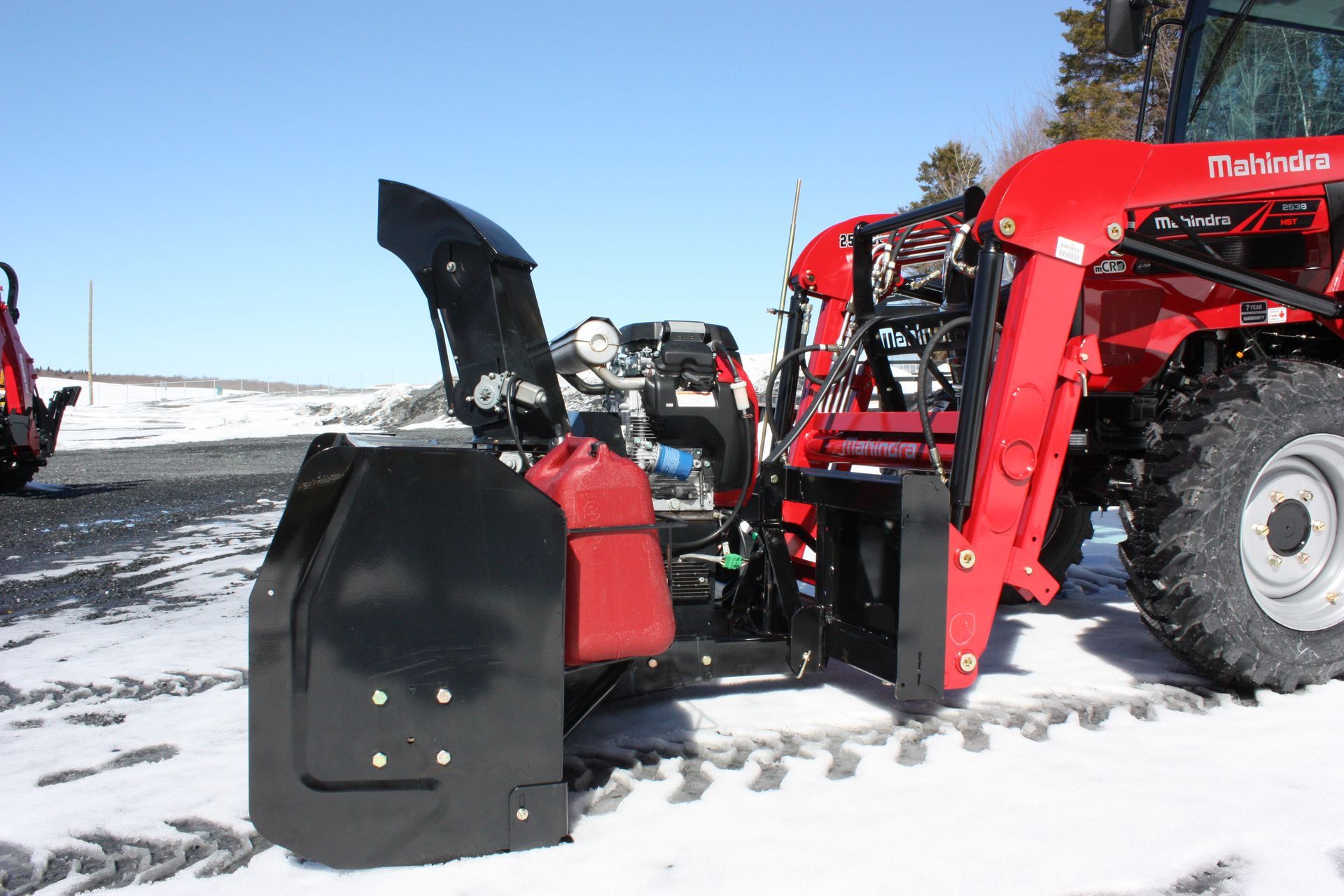 A red tractor with a snow blower 72″ VANTAGE SNOWBLOWER FOR TRACTORS EQUIPPED WITH