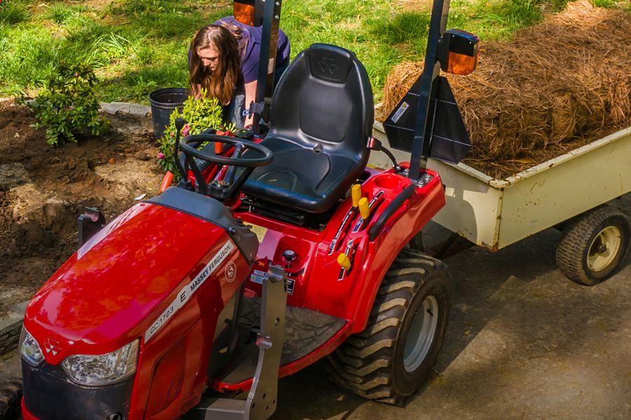 Woman using the tractor with loader