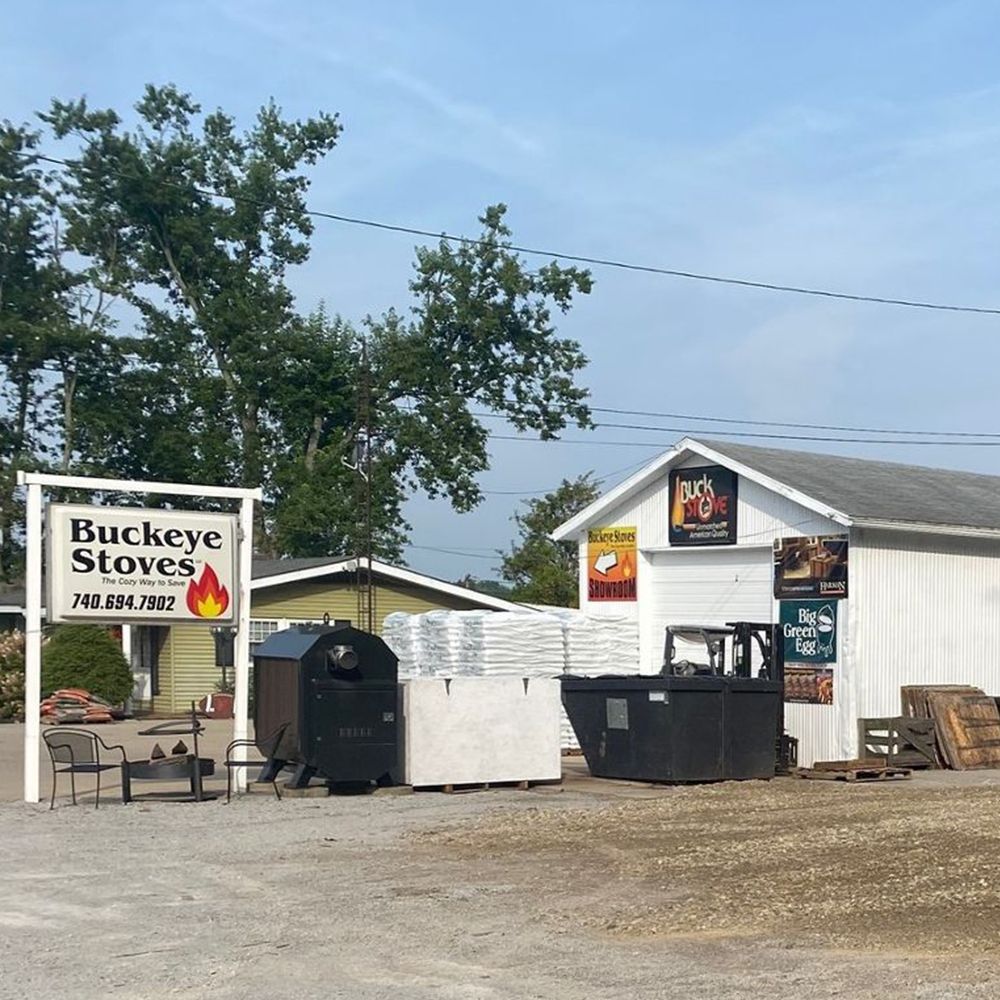 A sign for Buckeye Stoves is in front of a building