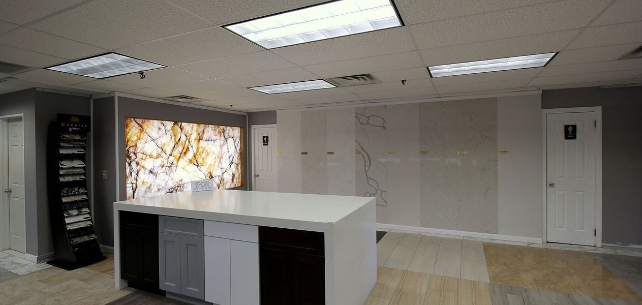 There is a countertop in the middle of the room