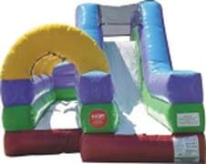 A colorful bouncy house with a slide and a tunnel.