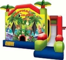 A colorful bouncy house with a slide and palm trees on it.