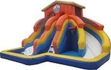 A large inflatable water slide in the shape of a house.