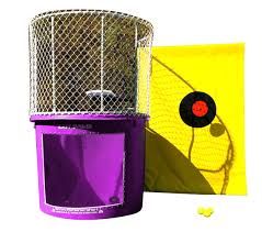 A purple dunk tank is sitting next to a yellow target.