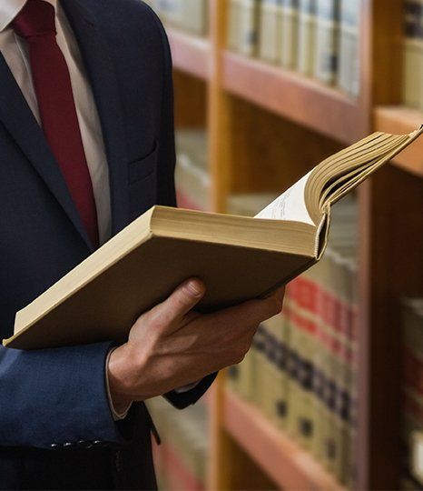 Man holding law book