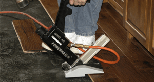 Man applying hardwood flooring