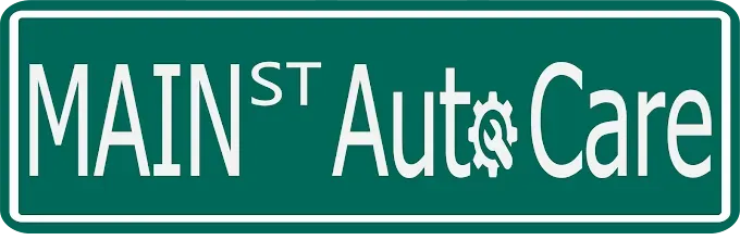 Green sign reading &ldquo;Main St Auto Care&rdquo; in white text with a gear in the word &ldquo;Auto.&rdquo;