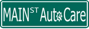 Green sign reading &ldquo;Main St Auto Care&rdquo; in white text with a gear in the word &ldquo;Auto.&rdquo;