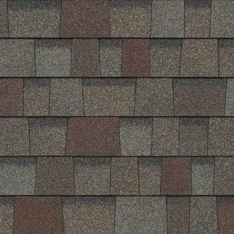 Close-up of asphalt roof shingles in shades of brown and gray.