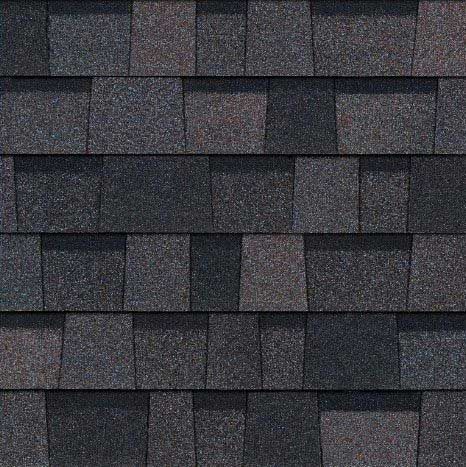 Dark gray asphalt roof shingles, arranged in a staggered, overlapping pattern.