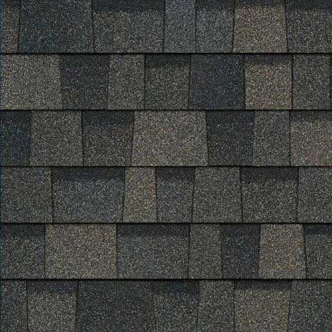 Dark gray asphalt roof shingles, textured surface.