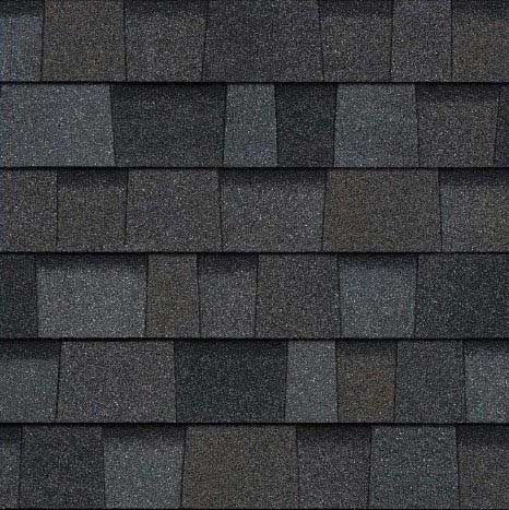 Close-up of asphalt roof shingles in varying shades of gray.