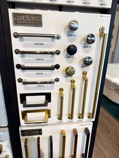 There are many different types of handles and knobs on display.