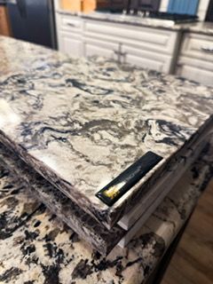 A stack of books sitting on top of each other on a counter.