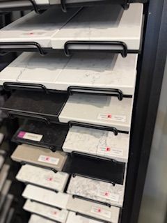 A display case filled with lots of different types of counter tops.