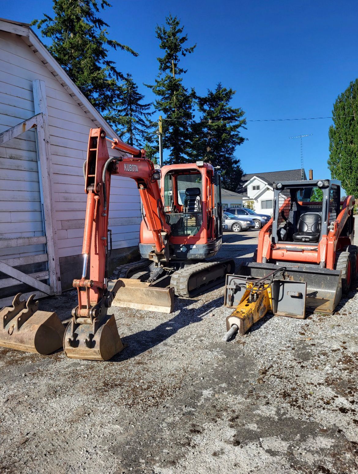 Excavator outside a house