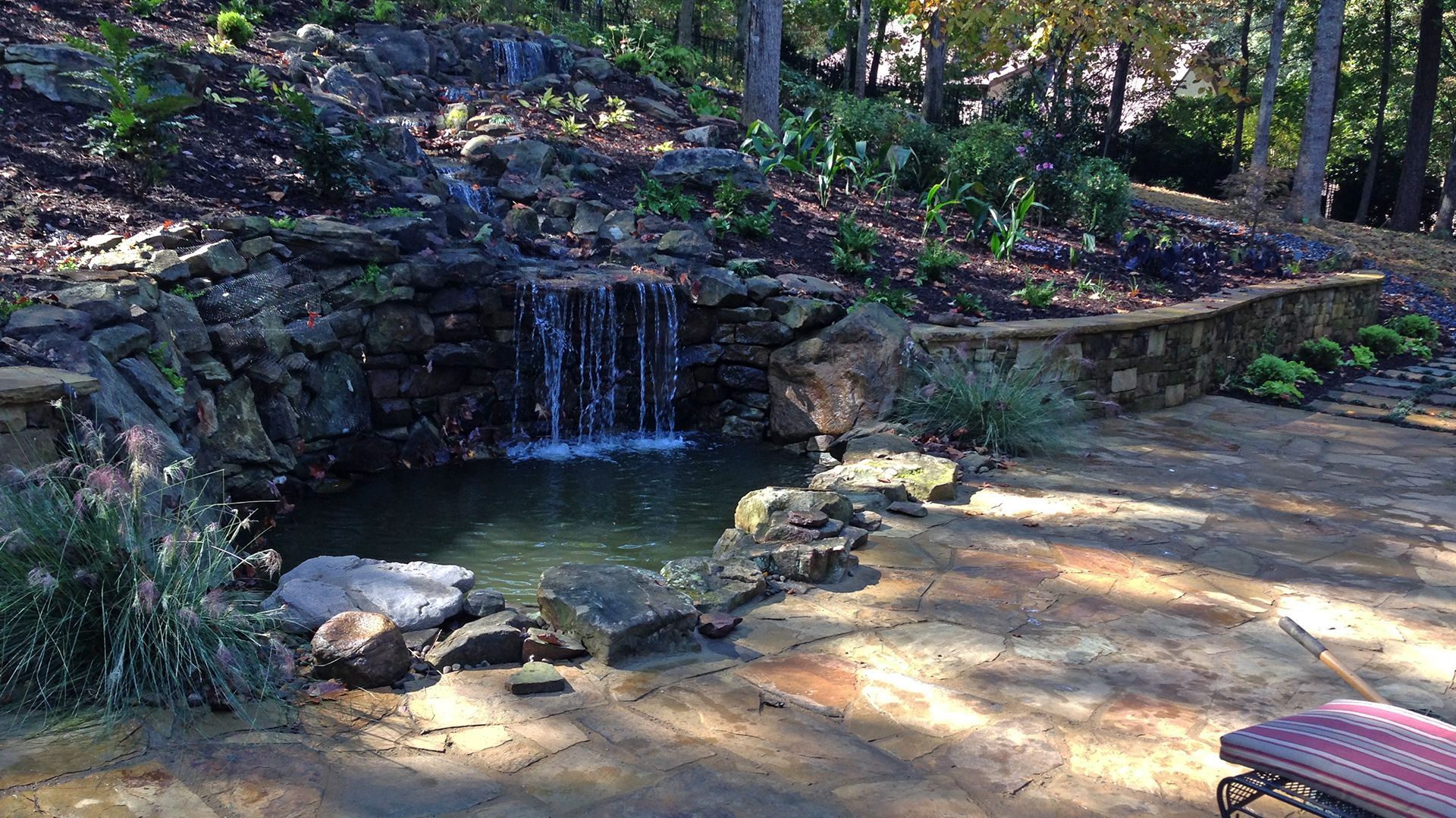 there is a small waterfall in the middle of the woods