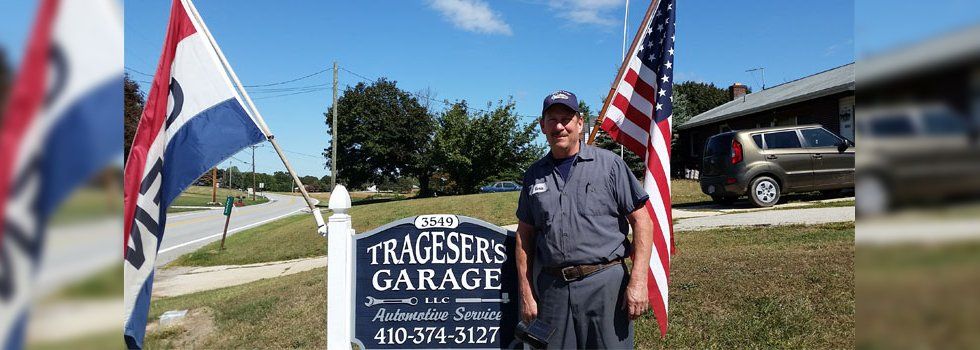 Trageser's Garage LLC sign with owner