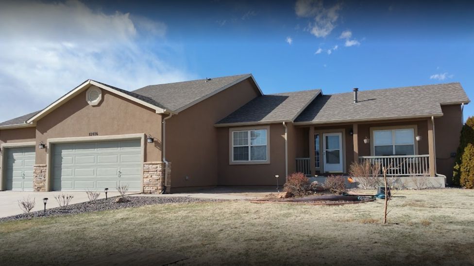 Residential house with a brown coat of stucco