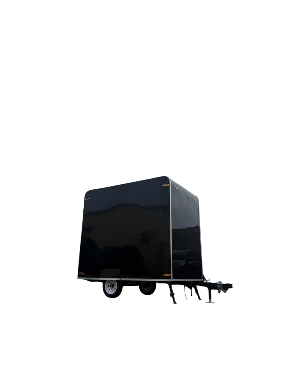Black enclosed cargo trailer on wheels, isolated on a white background