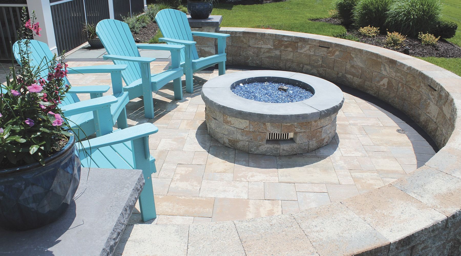 There is a fire pit in the middle of the patio.