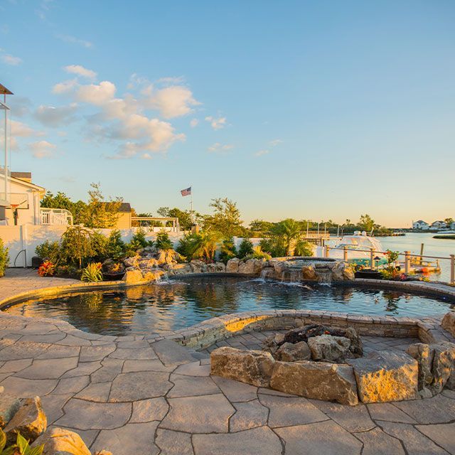 There is a fire pit in the middle of the pool.