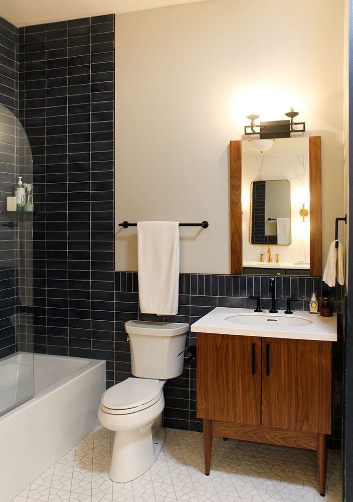 A bathroom with a toilet , sink and bathtub