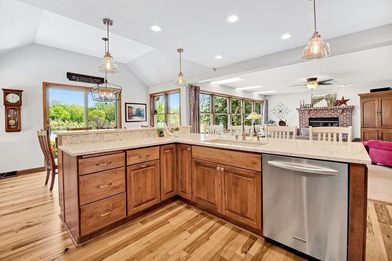 A kitchen with wooden cabinets and stainless steel appliances.