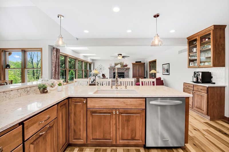 A kitchen with wooden cabinets and stainless steel appliances.