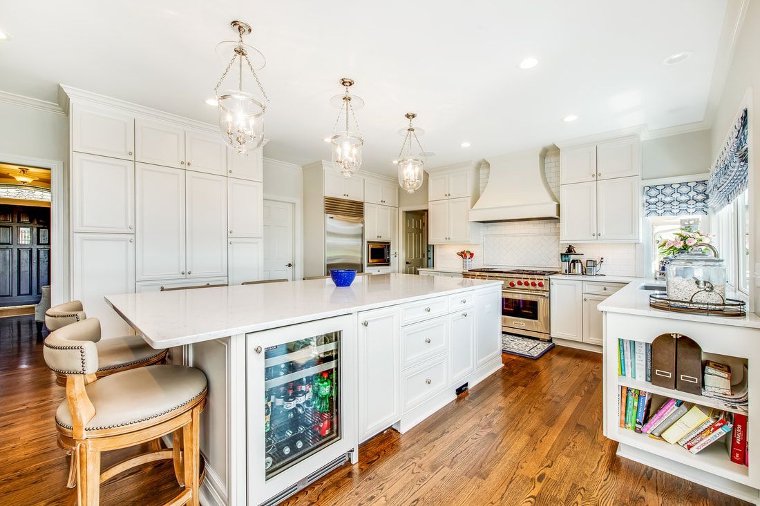 There is a large island in the middle of the kitchen.