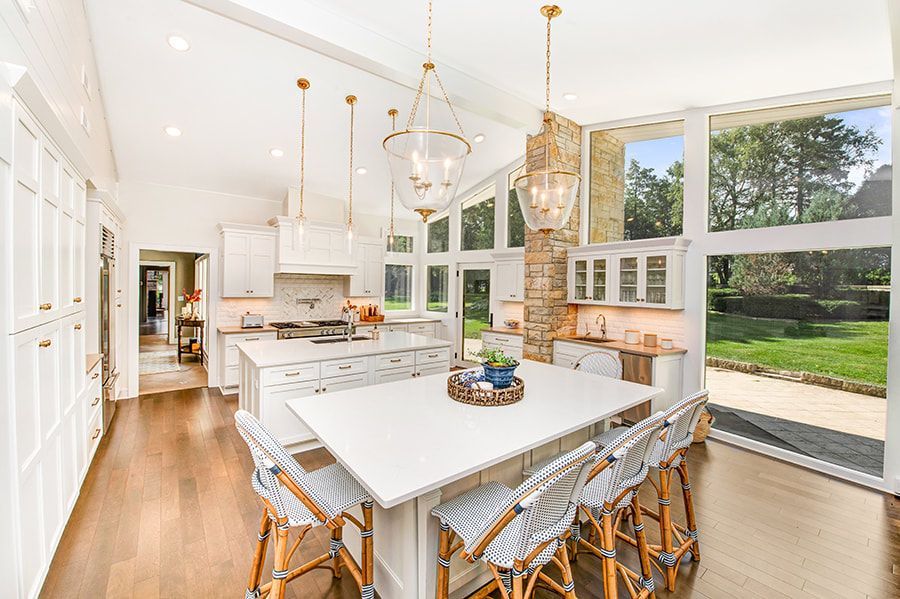 There is a large island in the middle of the kitchen.